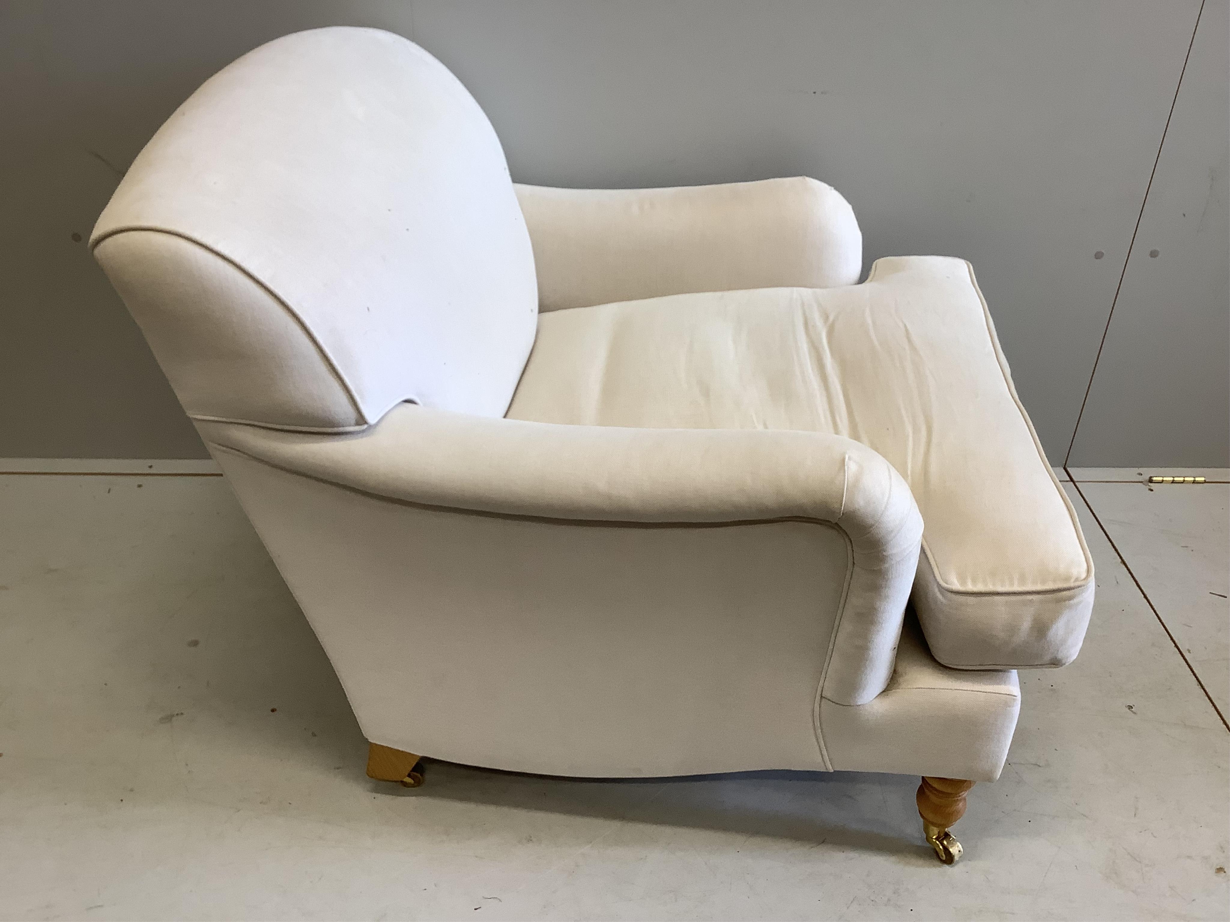 A Contemporary Howard style upholstered armchair, width 88cm, depth 94cm, height 82cm